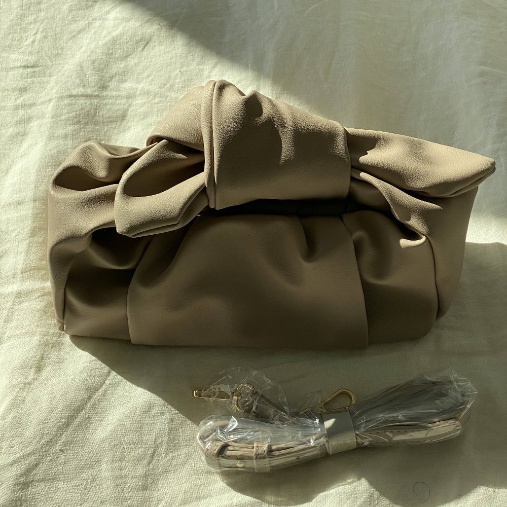 NEW cream hand pouch